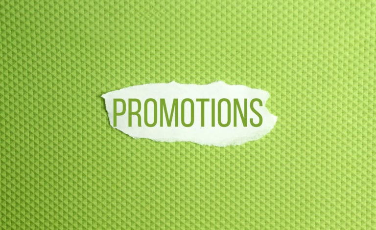 alt="the promotions term set on a green backdrop with small triangular textures on all four sides"