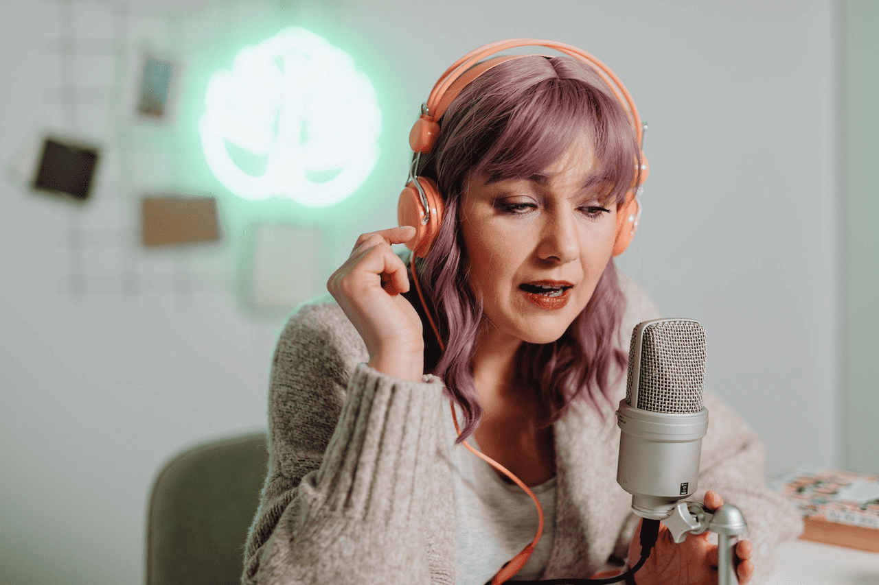 woman with violet hair recording