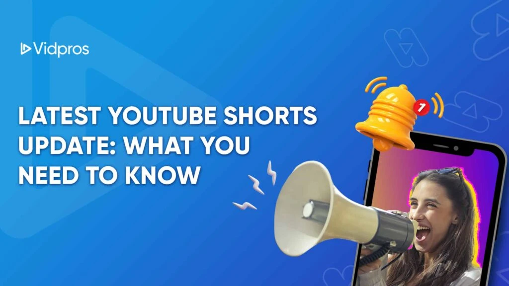 A digital illustration with text “Latest YouTube Shorts Update: What You Need to Know.” Features a smartphone with a woman holding a megaphone, and a yellow notification bell on the screen. The background is blue with geometric shapes and a Vidpros logo.